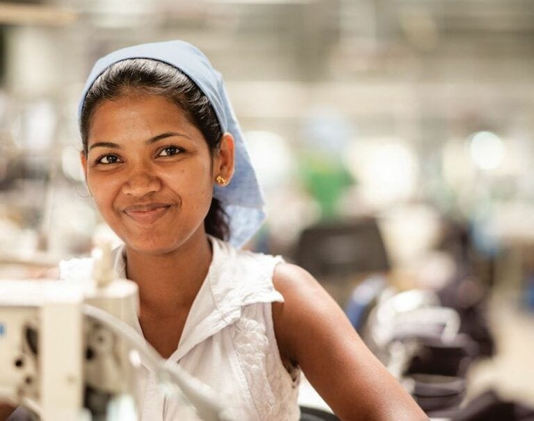 Woman working in a Patagonia clothingfactory